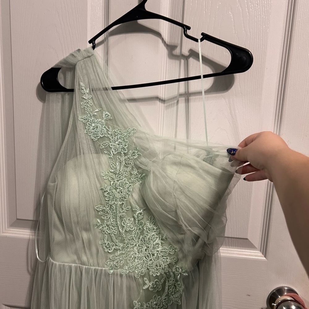 Light teal green prom dress with beaded details